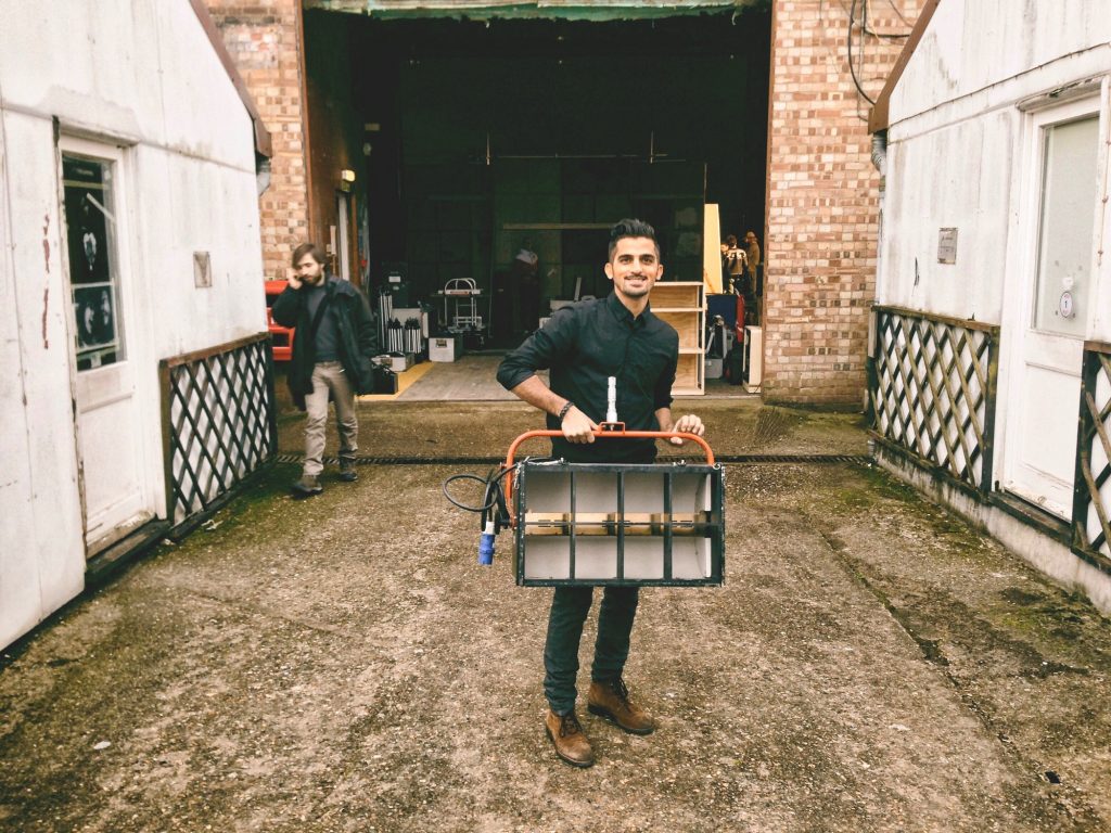 Happy man working for a film production company